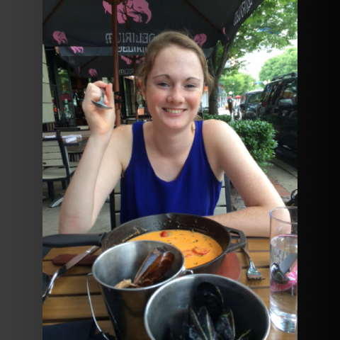 Hannah eating outside at a restaurant