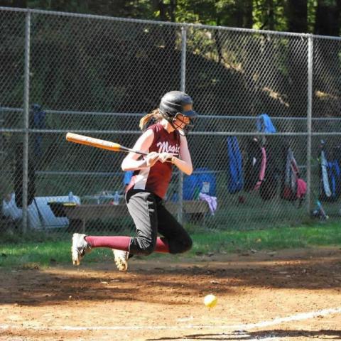 Hannah hitting a softball